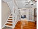 Inviting staircase leads to a comfortable living area with hardwood floors and ample natural light at 878 Elgin Dr, Winter Springs, FL 32708