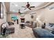 Spacious living room with tile flooring, fireplace, ceiling fans, and comfortable seating arrangements at 878 Elgin Dr, Winter Springs, FL 32708
