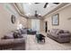 Open-concept living room with tile floors, multiple couches, and natural light at 878 Elgin Dr, Winter Springs, FL 32708
