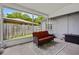 Relaxing screened patio featuring a comfortable couch, carpet, and view to yard at 878 Elgin Dr, Winter Springs, FL 32708