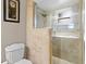 Modern bathroom features a tiled shower with frameless glass doors and updated fixtures at 878 Elgin Dr, Winter Springs, FL 32708