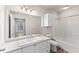 Well-lit bathroom with a single sink vanity, storage, and a shower-tub combination at 911 N Orange Ave # 321, Orlando, FL 32801