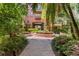 Exterior view of the building with courtyard, landscaping, and fountain at 911 N Orange Ave # 321, Orlando, FL 32801