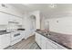 Well-lit kitchen with bright white appliances, ample counter space, and convenient washer/dryer closet at 911 N Orange Ave # 321, Orlando, FL 32801