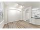 An open-concept living space boasting wood floors and access to the kitchen area at 911 N Orange Ave # 321, Orlando, FL 32801