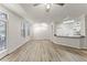 Bright living room with sleek flooring, a kitchen bar, and large windows with natural light at 911 N Orange Ave # 321, Orlando, FL 32801