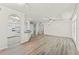Expansive living area with wood floors, ceiling fan, and an open view to the kitchen at 911 N Orange Ave # 321, Orlando, FL 32801