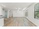 Spacious living room with modern flooring, bright lighting, and a view to the balcony at 911 N Orange Ave # 321, Orlando, FL 32801