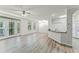 Spacious living room with modern flooring, sliding glass doors to balcony, and an open flow to the kitchen at 911 N Orange Ave # 321, Orlando, FL 32801