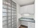 Cozy office nook with built-in desk and storage cabinets, enhanced by unique glass block detail at 911 N Orange Ave # 321, Orlando, FL 32801