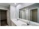 Bathroom featuring a double sink vanity with quartz countertop and large mirror at 1343 Lassen St, Haines City, FL 33844