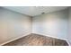 Bedroom featuring wood-look tile flooring, light gray walls, and overhead track lighting at 1343 Lassen St, Haines City, FL 33844