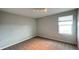 Cozy bedroom featuring plush carpeting, a bright window, and modern lighting at 1343 Lassen St, Haines City, FL 33844