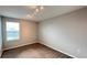 Bright bedroom with a window and soft carpeting, perfect for relaxation and comfort at 1343 Lassen St, Haines City, FL 33844
