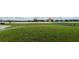 Community dog park area with grassy space, walking path, and a fence enclosure at 1343 Lassen St, Haines City, FL 33844