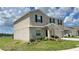 Charming two-story home featuring neutral stucco, black shutters, and well-maintained landscaping at 1343 Lassen St, Haines City, FL 33844