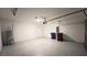 Spacious two-car garage with automatic door opener, water heater, and ample room for storage at 1343 Lassen St, Haines City, FL 33844