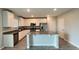 Modern kitchen featuring white cabinets, stainless steel appliances, and a center island at 1343 Lassen St, Haines City, FL 33844