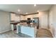 Contemporary kitchen with a large island, stainless steel appliances, and ample storage space at 1343 Lassen St, Haines City, FL 33844