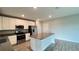 Stylish kitchen with stainless steel appliances, a large island, and plenty of cabinet space at 1343 Lassen St, Haines City, FL 33844
