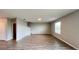 Spacious living area showcases wood-look tile flooring and natural light at 1343 Lassen St, Haines City, FL 33844
