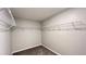 Spacious walk-in closet with installed wire shelving and neutral carpet at 1343 Lassen St, Haines City, FL 33844