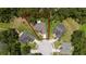 Aerial view showcasing the property's boundary within a lush green neighborhood with mature trees surrounding the area at 1405 Ashbury Ct, Lakeland, FL 33809