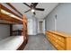 Practical bedroom featuring carpeted floors, bunk beds, neutral paint, and easy access to other areas of the home at 1405 Ashbury Ct, Lakeland, FL 33809