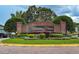 Beautiful brick entrance to Hampton Chase with manicured landscaping and prominent community signage at 1405 Ashbury Ct, Lakeland, FL 33809