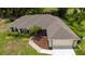 A high angle shot showing the roof and garage of a charming single-story home at 1405 Ashbury Ct, Lakeland, FL 33809