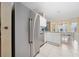 Spacious kitchen featuring stainless steel appliances, granite counters, and an island at 1405 Ashbury Ct, Lakeland, FL 33809