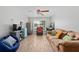 Comfortable living room with a sofa, accent chair, and wood-look tile floors at 1405 Ashbury Ct, Lakeland, FL 33809