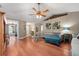 Spacious living room featuring hardwood floors, comfortable seating, and ample natural light for a cozy atmosphere at 1405 Ashbury Ct, Lakeland, FL 33809