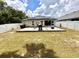 Expansive backyard with a patio provides an ideal space for outdoor gatherings and leisure at 144 Foxtail Loop, Davenport, FL 33837