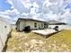 Spacious backyard featuring a paved patio area perfect for outdoor entertaining, and fenced perimeter at 144 Foxtail Loop, Davenport, FL 33837