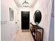 Stylish foyer featuring elegant decor, modern lighting, and a chic console table, creating a welcoming entrance at 144 Foxtail Loop, Davenport, FL 33837