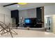 Cozy living room with modern decor, including a large flat-screen TV and comfortable seating at 144 Foxtail Loop, Davenport, FL 33837