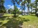 A backyard features a small seating area with a grill and a storage shed at 20414 Quinn St, Orlando, FL 32833