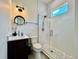 This bathroom features a modern vanity, toilet, and shower with glass door and mosaic tile flooring at 20414 Quinn St, Orlando, FL 32833