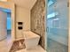 Elegant bathroom with modern soaking tub, glass shower, and stylish tile, perfect for relaxation at 20414 Quinn St, Orlando, FL 32833