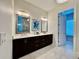 Spacious bathroom with double vanity, modern mirrors, and stylish lighting fixtures for an upscale feel at 20414 Quinn St, Orlando, FL 32833