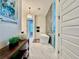 Luxurious bathroom featuring a modern soaking tub, glass shower, and stylish tile flooring at 20414 Quinn St, Orlando, FL 32833