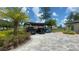 Carport, lush landscaping and paved driveway at 20414 Quinn St, Orlando, FL 32833