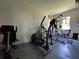 Workout room featuring weight machines, an elliptical, and natural light at 20414 Quinn St, Orlando, FL 32833