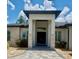 Stunning front entrance of home featuring stone accents, a tiled walkway, and a modern design at 20414 Quinn St, Orlando, FL 32833