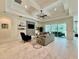 Open concept living area showcases tray ceilings, access to the kitchen, and a neutral color palette at 20414 Quinn St, Orlando, FL 32833