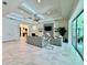 Open concept living area features tray ceilings and sliding glass doors that lead to the outdoor patio at 20414 Quinn St, Orlando, FL 32833