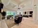 Spacious living room boasts tray ceiling, neutral tones, access to outdoor patio and open to kitchen at 20414 Quinn St, Orlando, FL 32833