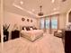 Spacious main bedroom with tray ceiling, elegant decor, and large windows for ample natural light at 20414 Quinn St, Orlando, FL 32833