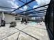 Relaxing screened pool with stone patio, and a seating area to enjoy outdoor living at its finest at 20414 Quinn St, Orlando, FL 32833